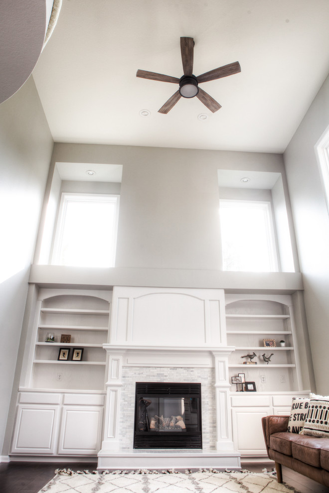 Home design - huge transitional open concept dark wood floor and brown floor home design idea with gray walls, a standard fireplace, a tile fireplace and no tv