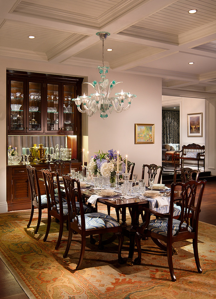 Large traditional open plan dining in Miami with dark hardwood floors, beige walls and brown floor.