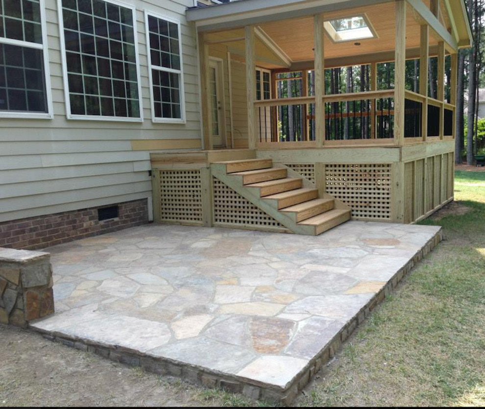 Deck - mid-sized transitional side yard deck idea in Raleigh with a roof extension