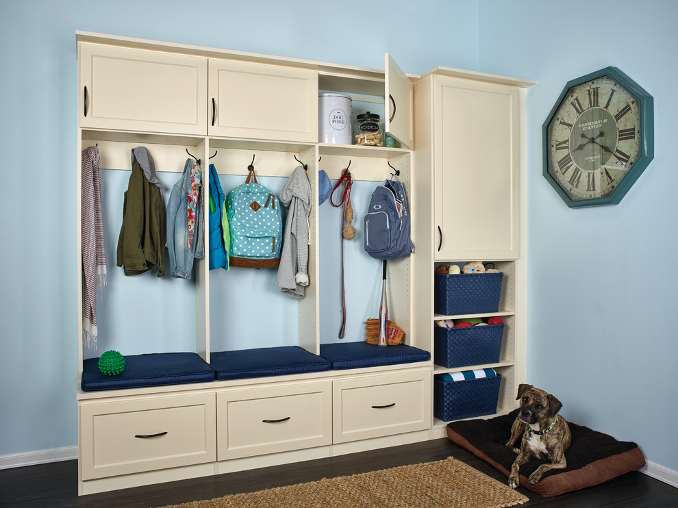 Inspiration for a mid-sized traditional mudroom in Seattle with blue walls and dark hardwood floors.