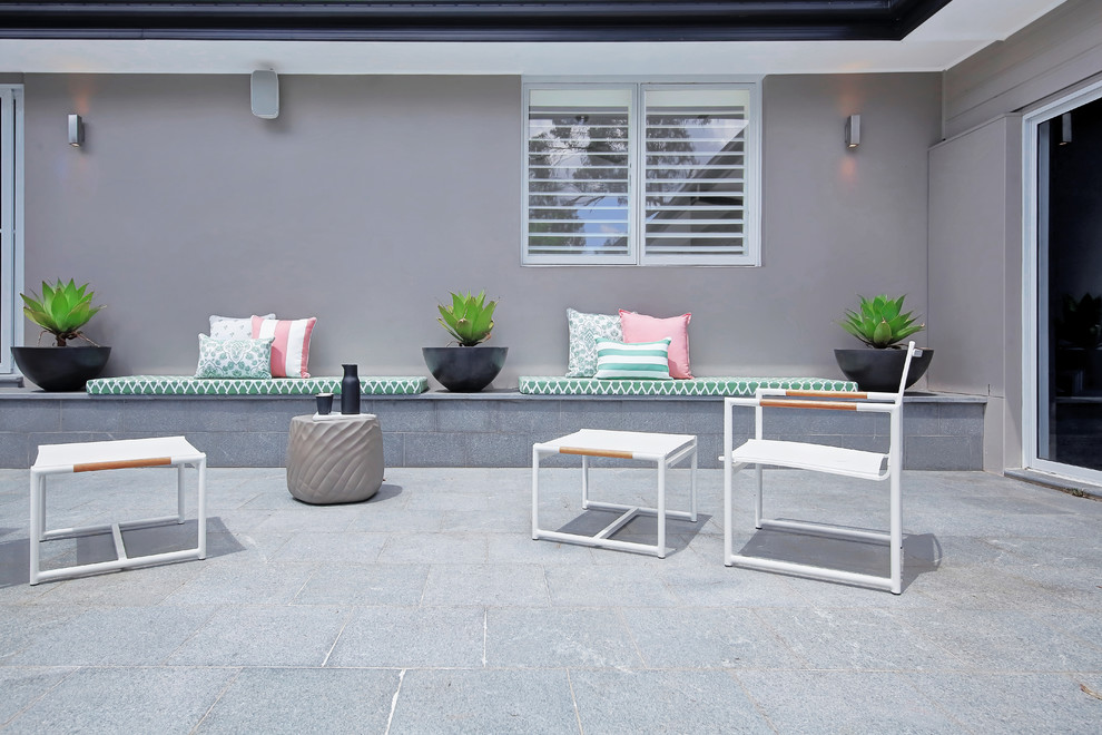 This is an example of a contemporary patio in Sydney with no cover.