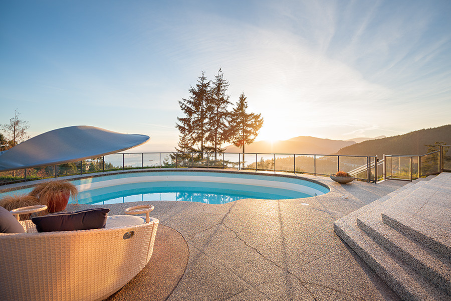 Pool - huge transitional backyard concrete and kidney-shaped lap pool idea in Vancouver