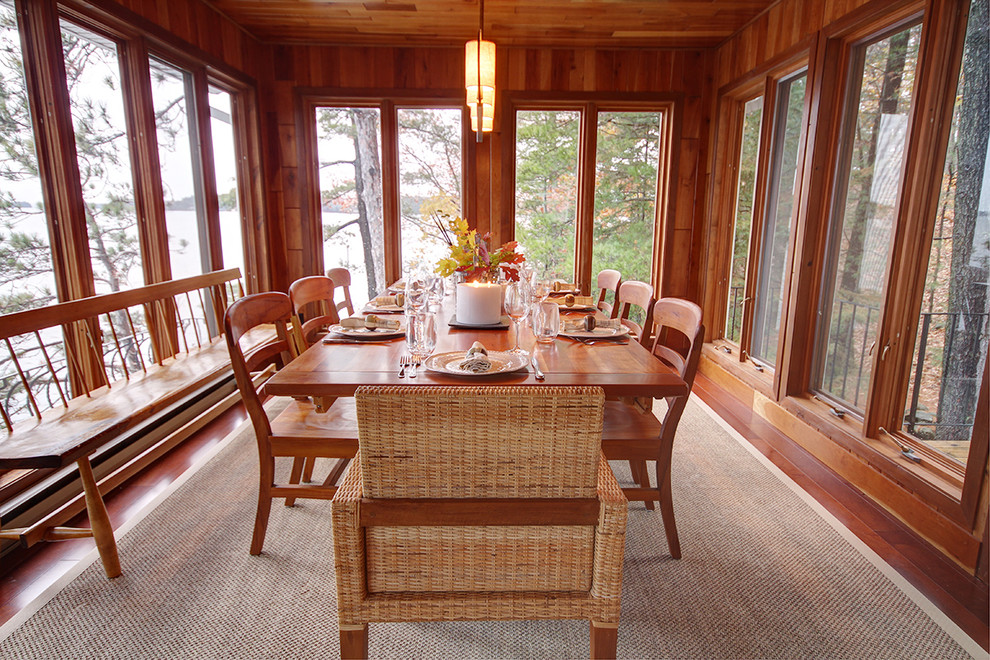 Photo of a traditional separate dining room in Toronto with dark hardwood floors.