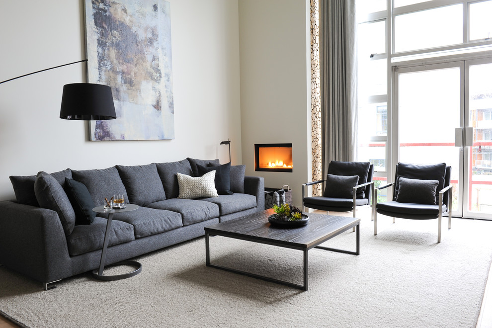 Inspiration for a contemporary living room in Vancouver with white walls and a ribbon fireplace.