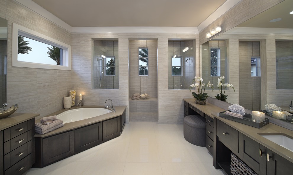 This is an example of a contemporary bathroom in Miami with a corner tub.