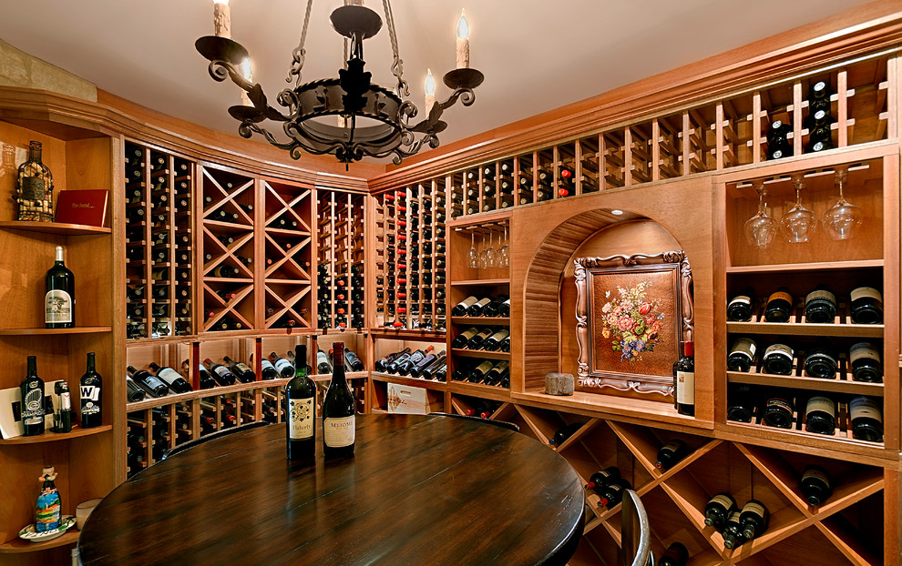 This is an example of a mid-sized mediterranean wine cellar in Chicago with brown floor and ceramic floors.
