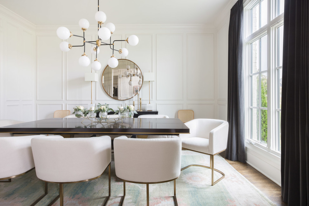 Inspiration for a contemporary dining room in Nashville with white walls, medium hardwood floors and brown floor.
