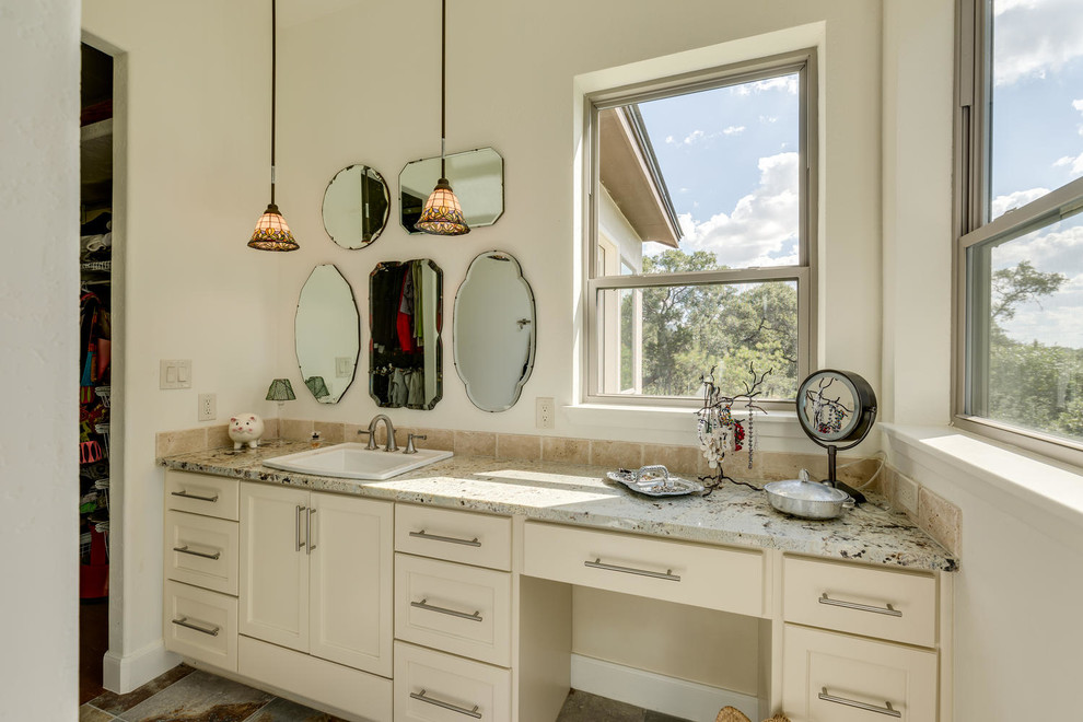 Mid-sized traditional 3/4 bathroom in Orange County with flat-panel cabinets, white cabinets, white walls, medium hardwood floors, a drop-in sink, engineered quartz benchtops, brown floor, an alcove tub, a shower/bathtub combo, a two-piece toilet, beige tile, travertine and a shower curtain.