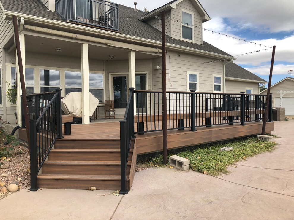 Deck - mid-sized transitional backyard deck idea in Denver with no cover