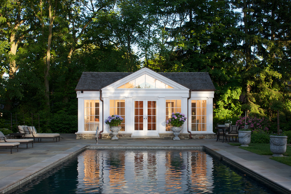 Inspiration for a traditional rectangular pool in Chicago with a pool house.