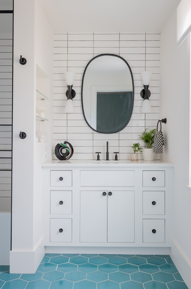 Example of a mid-sized transitional kids' white tile and ceramic tile ceramic tile, turquoise floor and single-sink bathroom design in Boston with recessed-panel cabinets, white cabinets, a two-piece toilet, white walls, an undermount sink, quartz countertops, white countertops, a niche and a built-in vanity