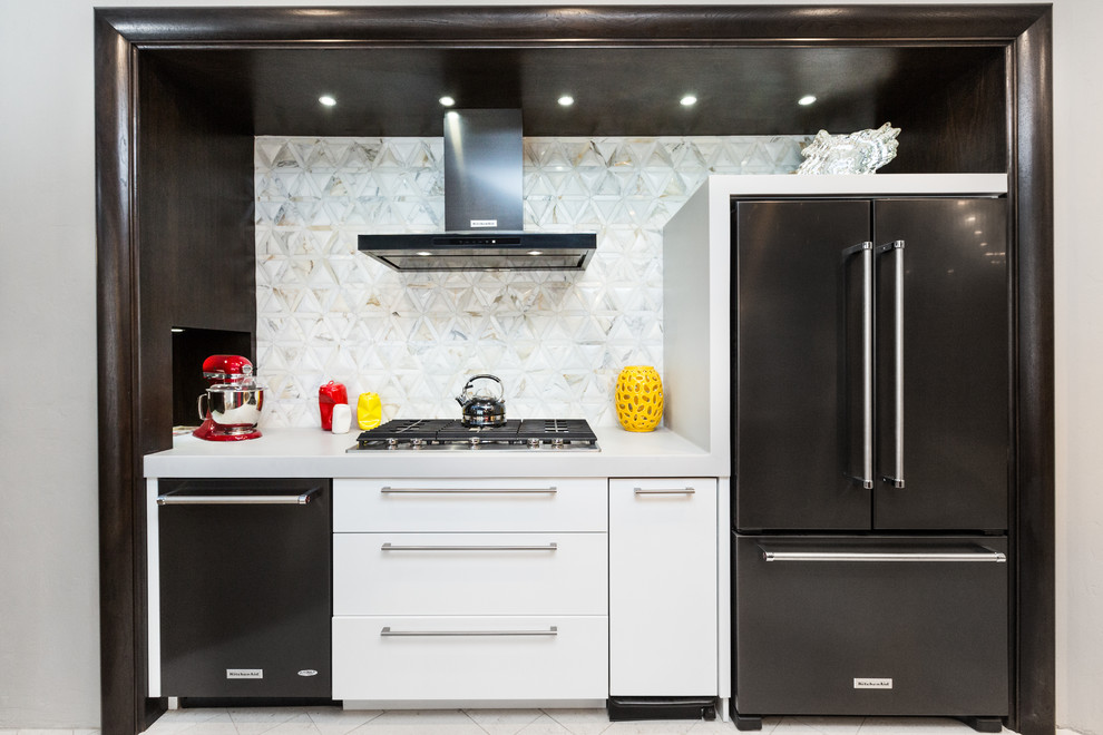 Example of a huge transitional limestone floor kitchen design in Albuquerque with an undermount sink, white backsplash, glass sheet backsplash and an island
