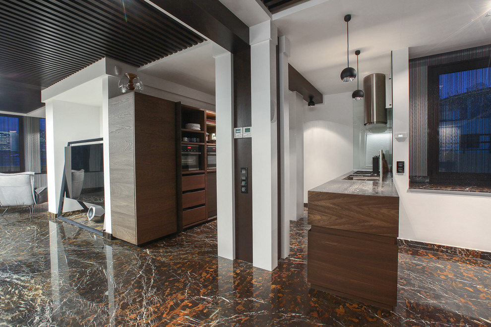 Photo of a contemporary single-wall kitchen in Moscow with brown floor.