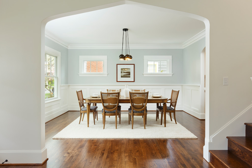 Traditional separate dining room in Portland with grey walls and dark hardwood floors.