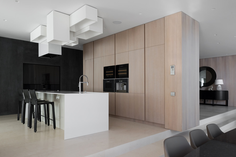 Photo of a contemporary single-wall eat-in kitchen in Moscow with flat-panel cabinets, black appliances, with island and beige floor.