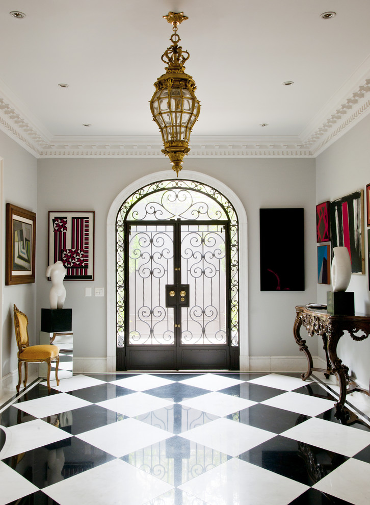 Inspiration for a traditional entryway in Other with a double front door, a metal front door and multi-coloured floor.
