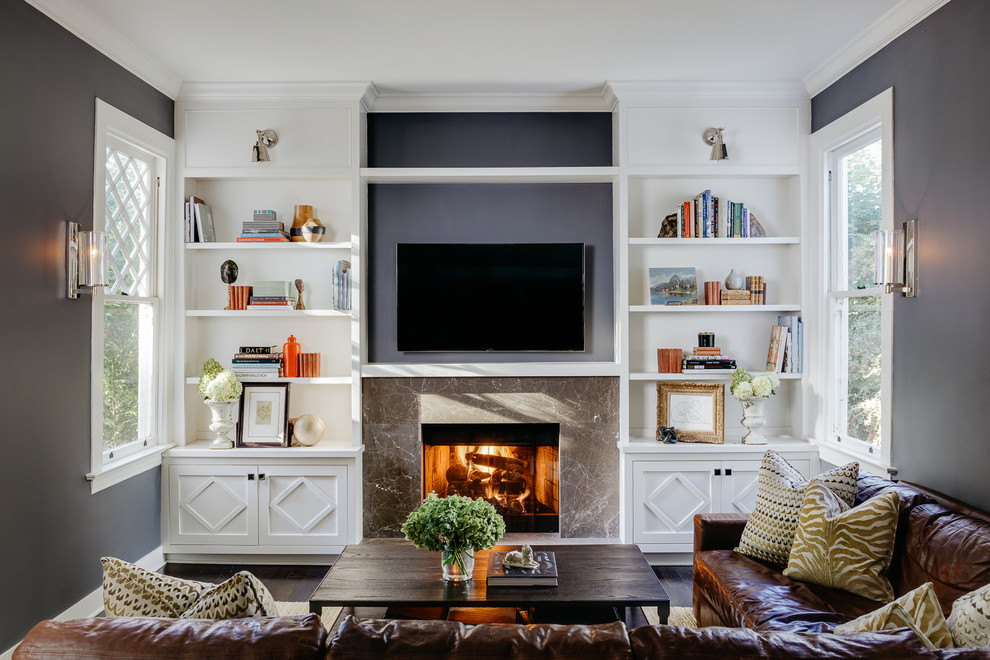 Inspiration for a mid-sized traditional enclosed family room in San Francisco with grey walls, dark hardwood floors, a standard fireplace and a stone fireplace surround.