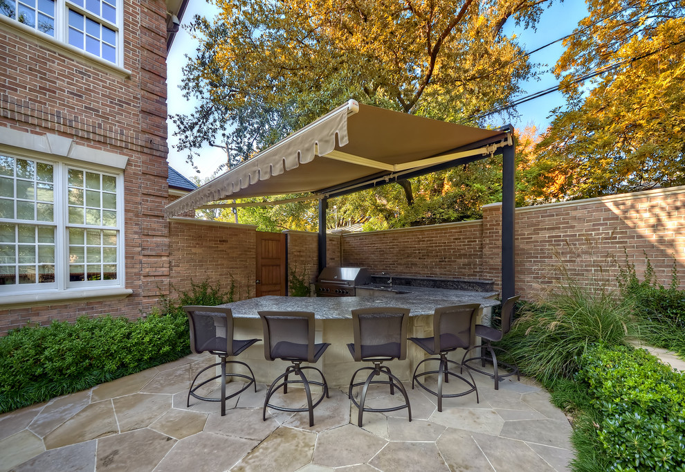 Design ideas for a traditional patio in Dallas with an outdoor kitchen.