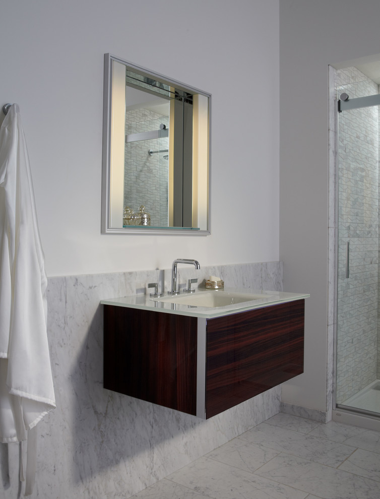 Photo of a transitional master bathroom in Philadelphia with an integrated sink, glass benchtops, a double shower, white tile, stone slab and marble floors.