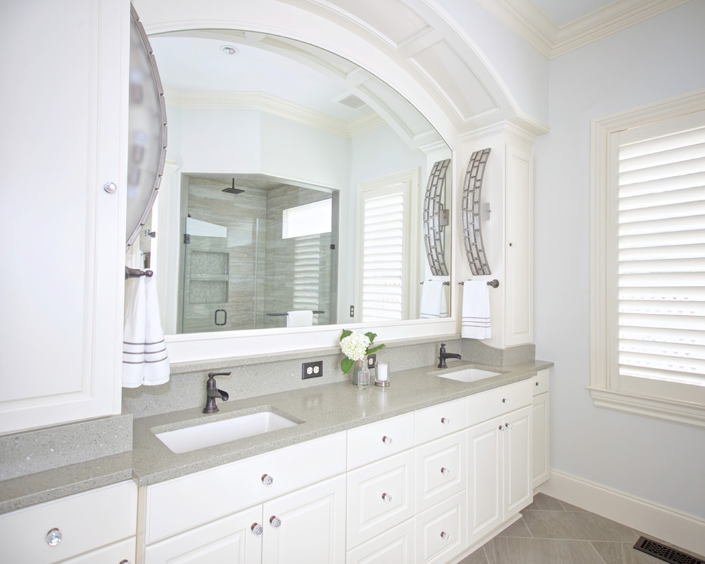Design ideas for a mid-sized transitional master bathroom in Raleigh with raised-panel cabinets, white cabinets, grey walls, porcelain floors, an undermount sink, terrazzo benchtops and grey floor.