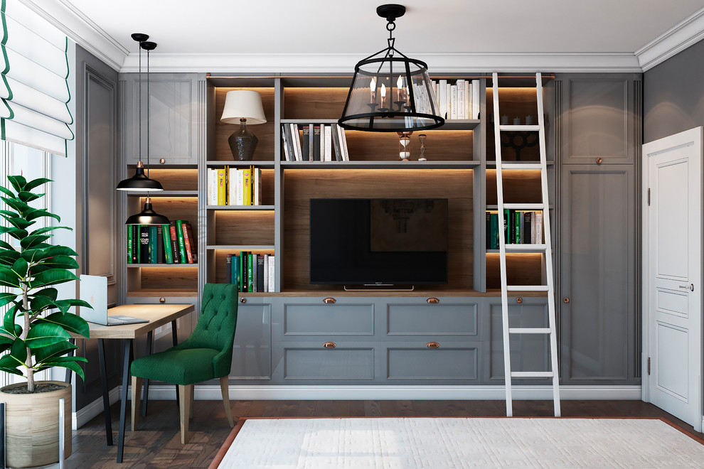 Photo of a mid-sized traditional home office in Other with a library, grey walls and a freestanding desk.