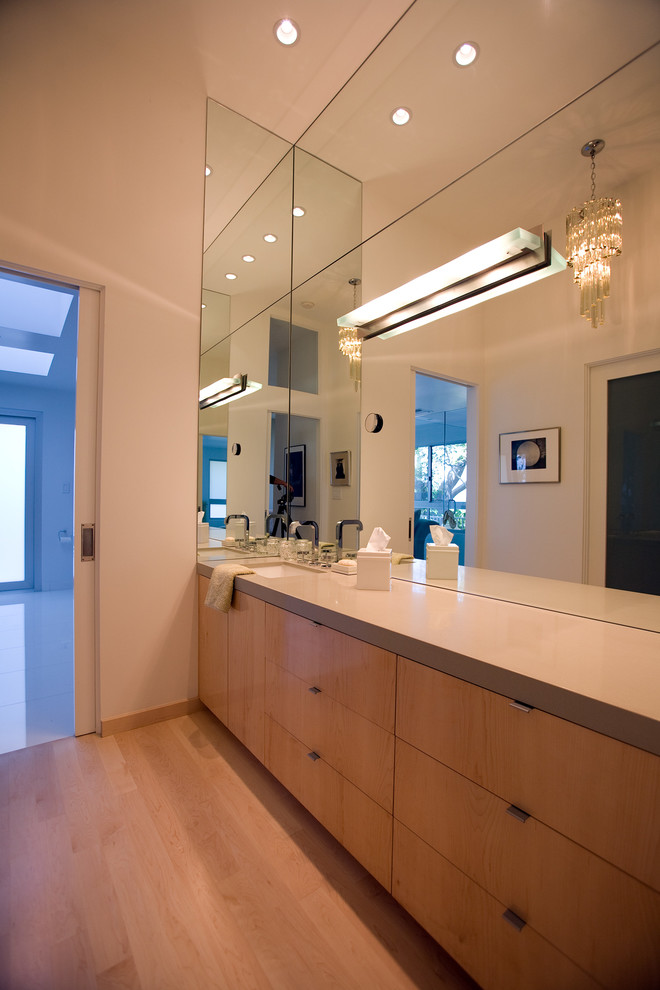 This is an example of a large modern master bathroom in Los Angeles with flat-panel cabinets, light wood cabinets, gray tile, white walls, light hardwood floors, an undermount sink and quartzite benchtops.