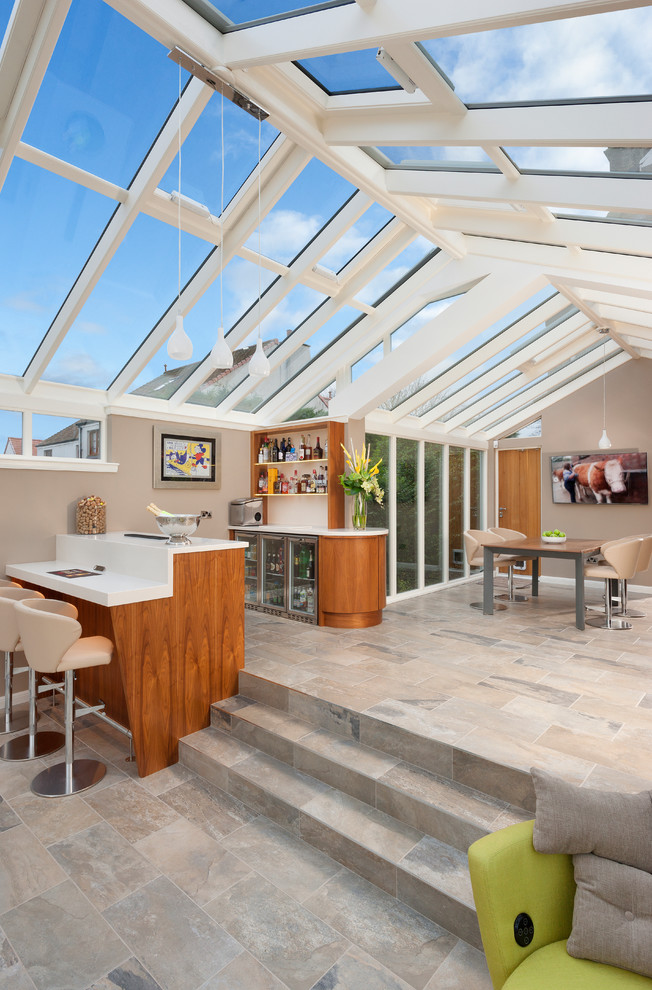 Design ideas for a mid-sized modern sunroom in Glasgow with travertine floors, grey floor and a glass ceiling.