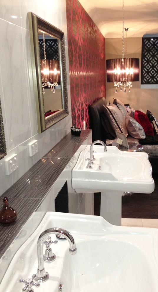 Large traditional master bathroom in Brisbane with a pedestal sink, white tile, white walls and ceramic floors.