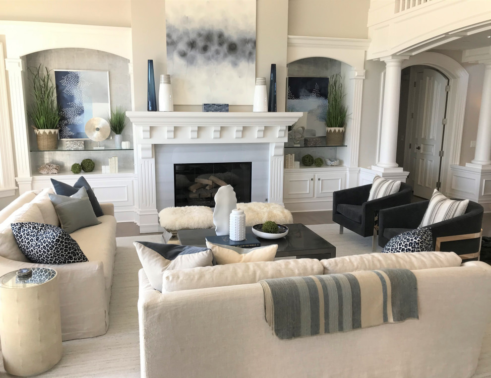 This is an example of a large coastal formal open plan living room in Sacramento with grey walls, medium hardwood flooring, a standard fireplace, a wooden fireplace surround, no tv, grey floors, a vaulted ceiling and wallpapered walls.