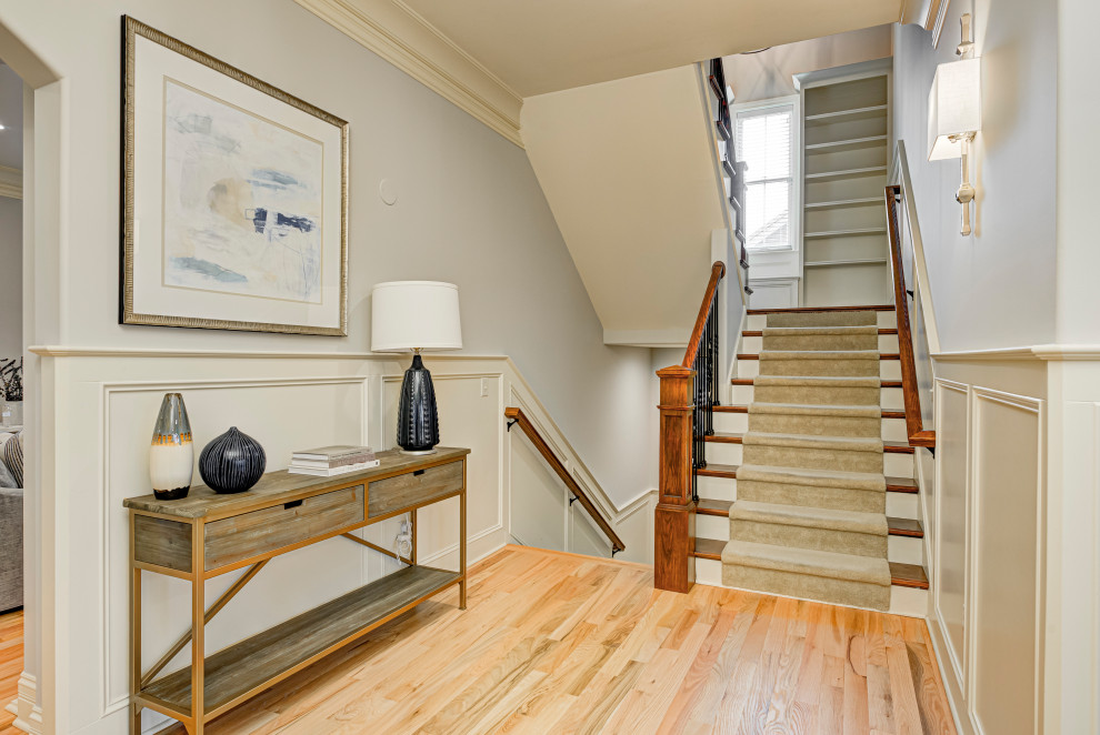 Staircase - mid-sized transitional wooden u-shaped mixed material railing staircase idea in Indianapolis with wooden risers