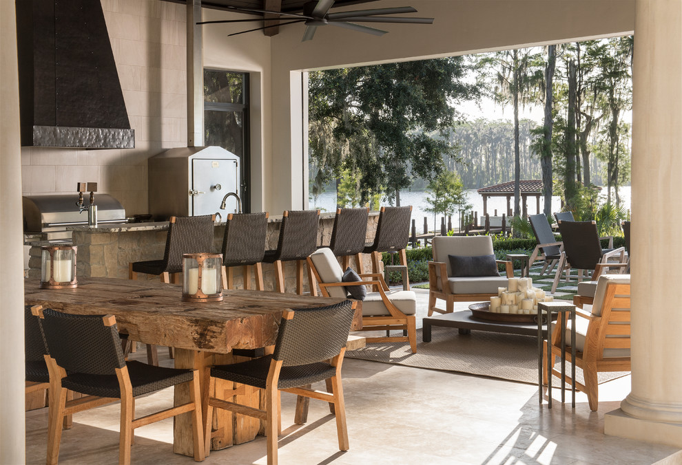 Patio - mediterranean backyard tile patio idea in Orlando with a roof extension