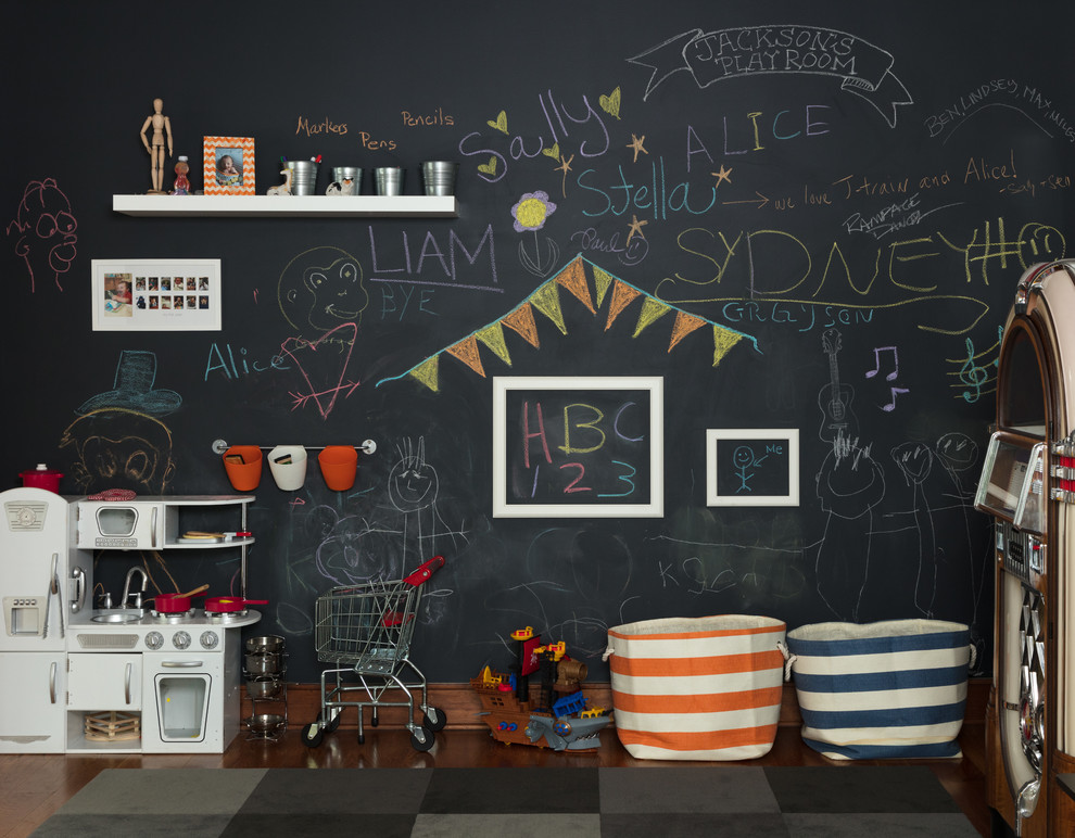 Contemporary gender-neutral kids' playroom in Other with black walls, medium hardwood floors and brown floor.
