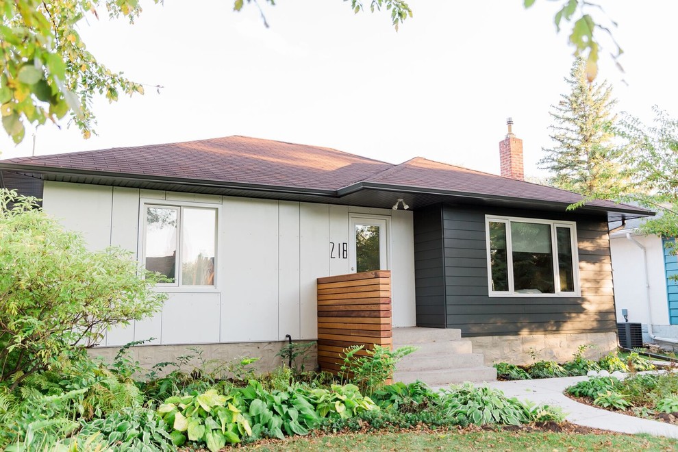 This is an example of a small contemporary one-storey multi-coloured house exterior in Other with mixed siding, a gable roof and a shingle roof.