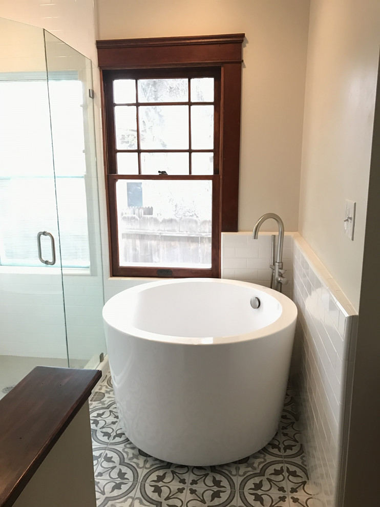 Inspiration for a small midcentury bathroom in San Luis Obispo with dark wood cabinets, a japanese tub, a corner shower, a one-piece toilet, white tile, ceramic tile, white walls, porcelain floors, an undermount sink, marble benchtops, multi-coloured floor and a hinged shower door.