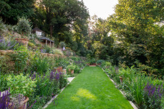 Lush Terraced Landscape Takes Shape on a Steep Slope