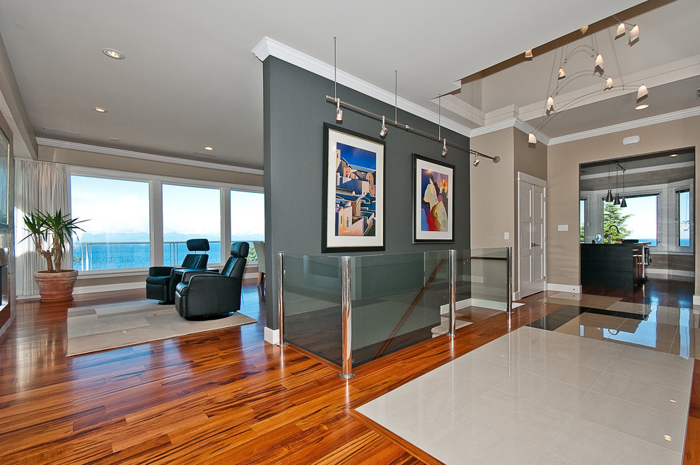 Example of a large transitional porcelain tile and multicolored floor entry hall design with beige walls and a dark wood front door