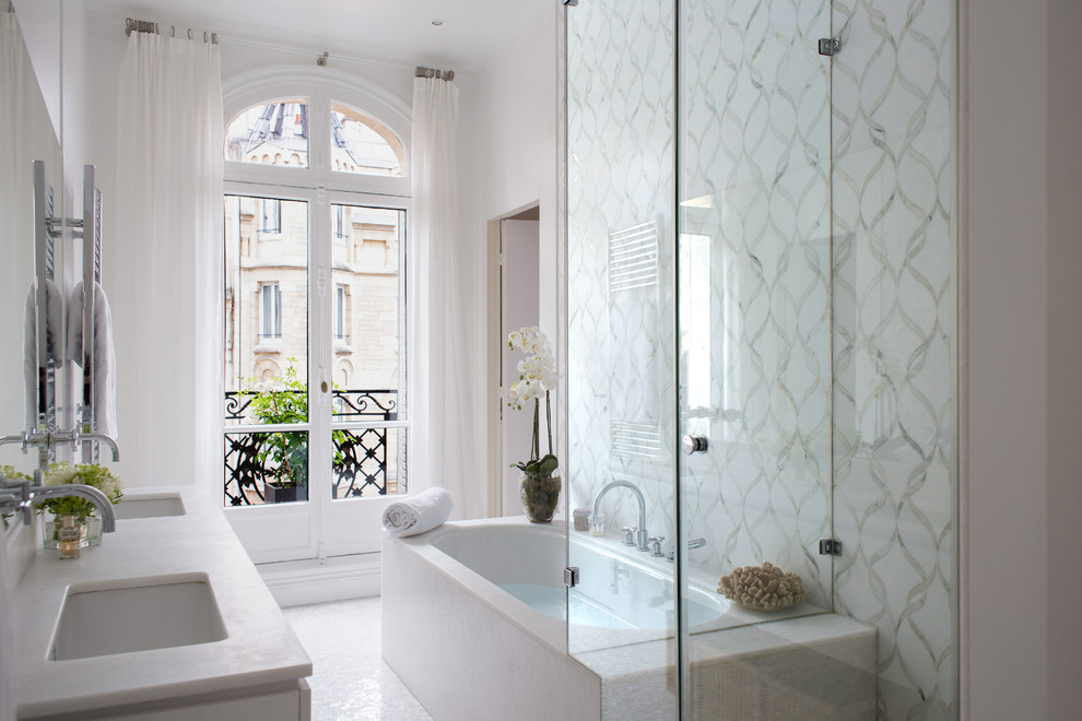 This is an example of a traditional bathroom in Toronto with an undermount sink, an undermount tub, a corner shower, white tile and white walls.