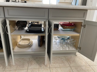 Example of a large u-shaped eat-in kitchen design with flat-panel cabinets, gray cabinets, laminate countertops and a peninsula