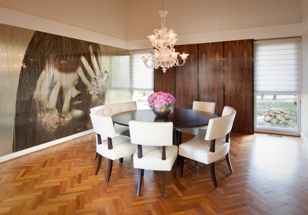 This is an example of a modern dining room in Miami with medium hardwood floors, no fireplace and metallic walls.