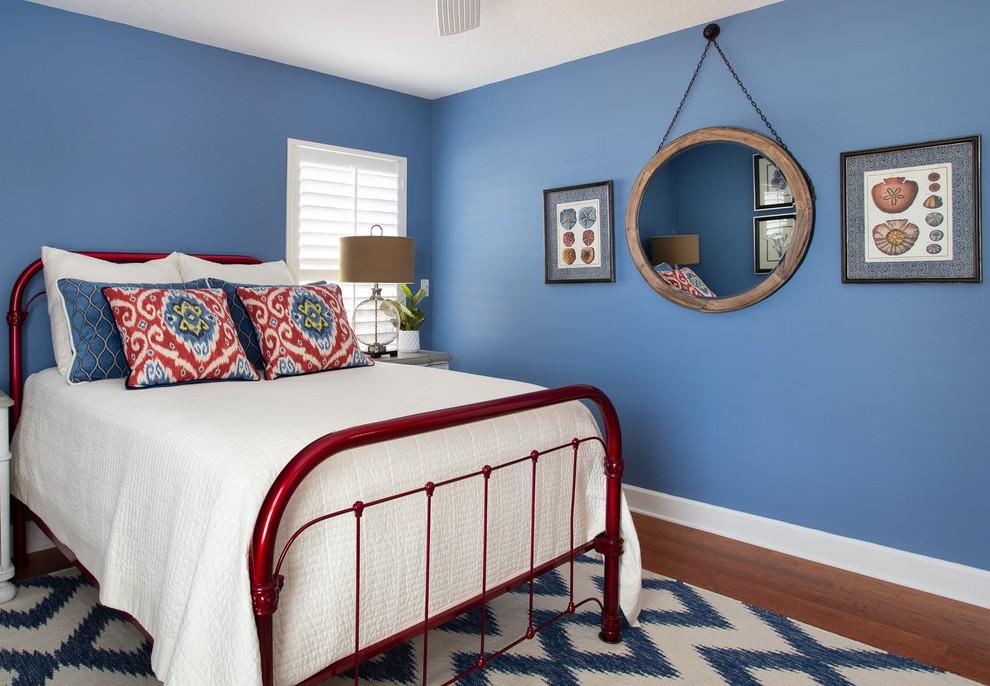 Design ideas for a transitional guest bedroom in Orlando with blue walls.
