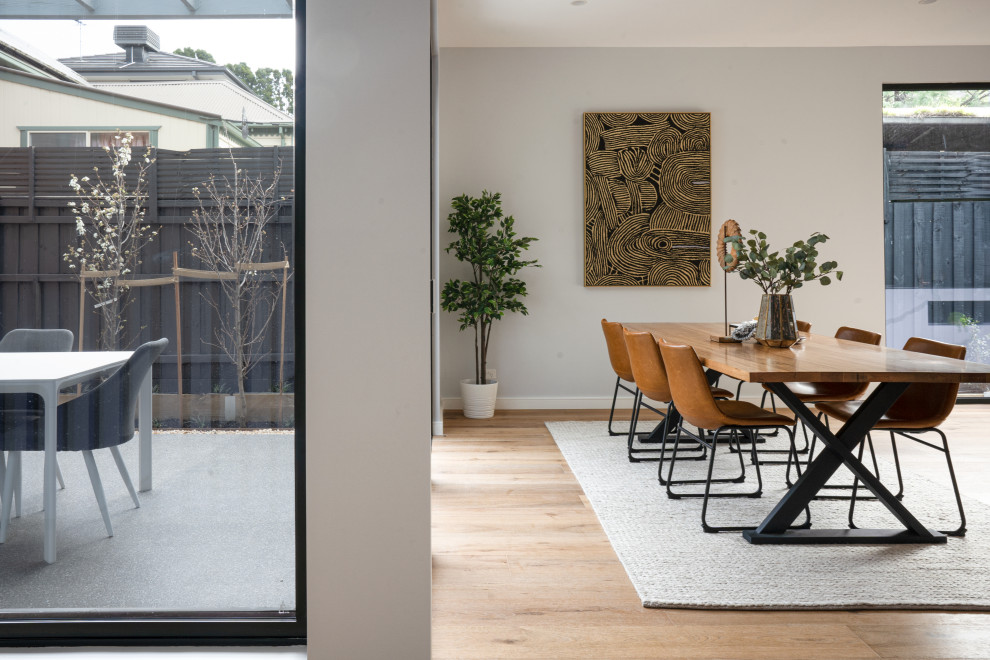 Design ideas for a mid-sized contemporary open plan dining in Melbourne.