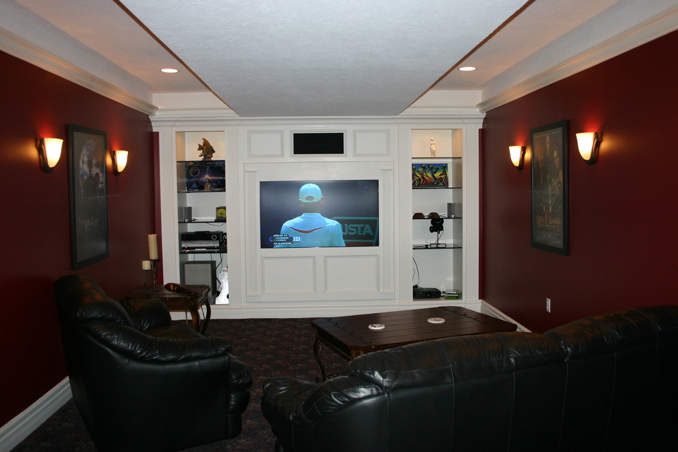 Small transitional enclosed home theatre in Indianapolis with red walls and a built-in media wall.