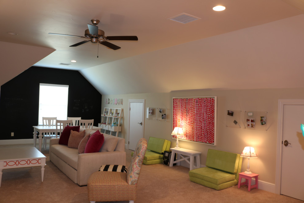 This is an example of a large transitional kids' room for girls in Austin with beige walls, carpet and beige floor.