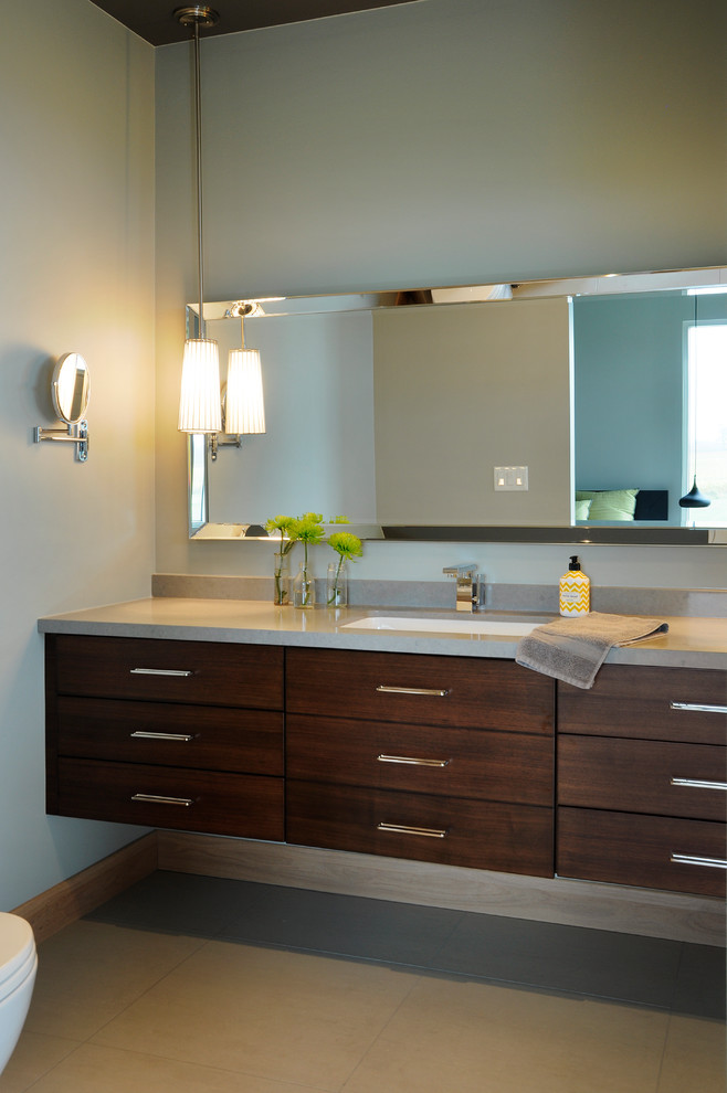 Photo of a large contemporary master bathroom in Toronto with an undermount sink, flat-panel cabinets, medium wood cabinets, engineered quartz benchtops, a one-piece toilet and grey walls.