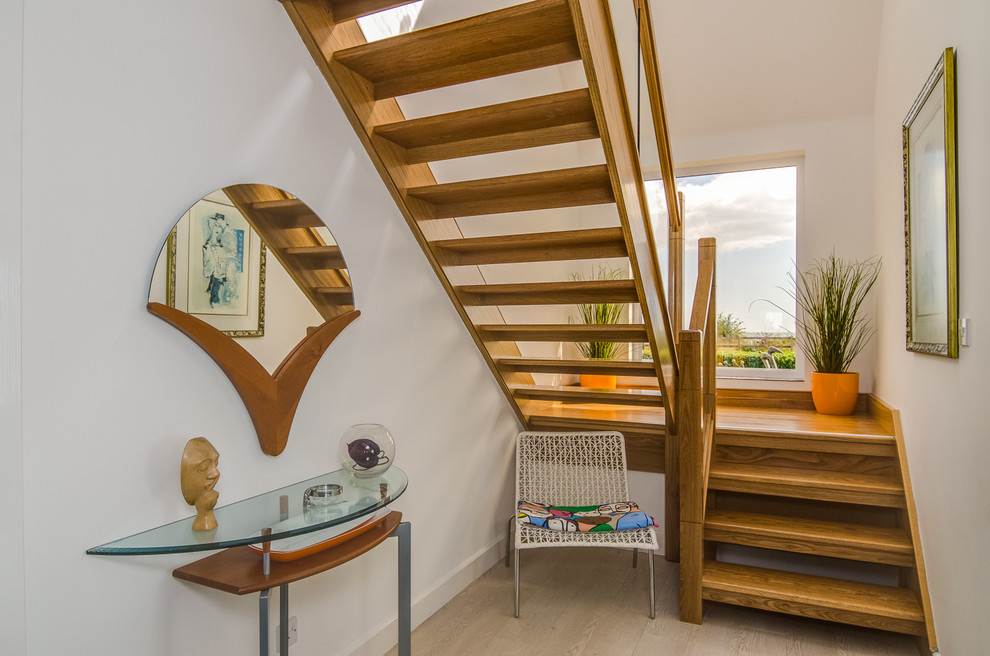 Inspiration for a mid-sized beach style wood l-shaped staircase in Belfast with open risers.