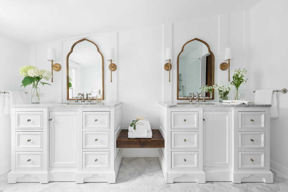 This is an example of a mid-sized traditional master bathroom in Chicago with white cabinets, white walls, marble floors, an undermount sink, marble benchtops, white floor, grey benchtops and recessed-panel cabinets.