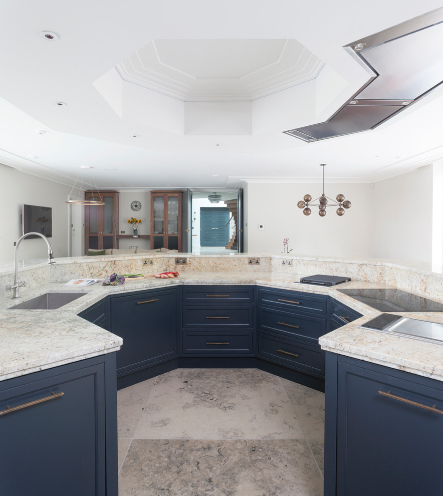 Large transitional open plan kitchen in Wiltshire with a single-bowl sink, beaded inset cabinets, grey cabinets, multi-coloured splashback, with island, stainless steel appliances, limestone floors and granite benchtops.