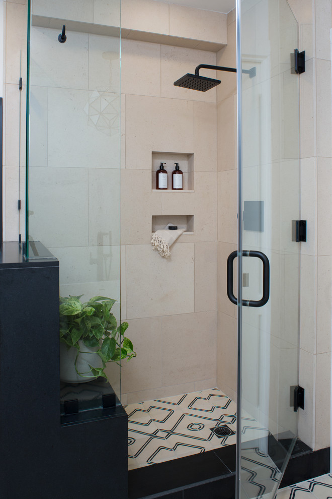 Photo of a mid-sized contemporary master bathroom in Los Angeles with flat-panel cabinets, medium wood cabinets, a freestanding tub, a corner shower, a two-piece toilet, beige tile, marble, white walls, ceramic floors, an undermount sink, granite benchtops, multi-coloured floor, a hinged shower door, black benchtops, a shower seat, a double vanity and a built-in vanity.