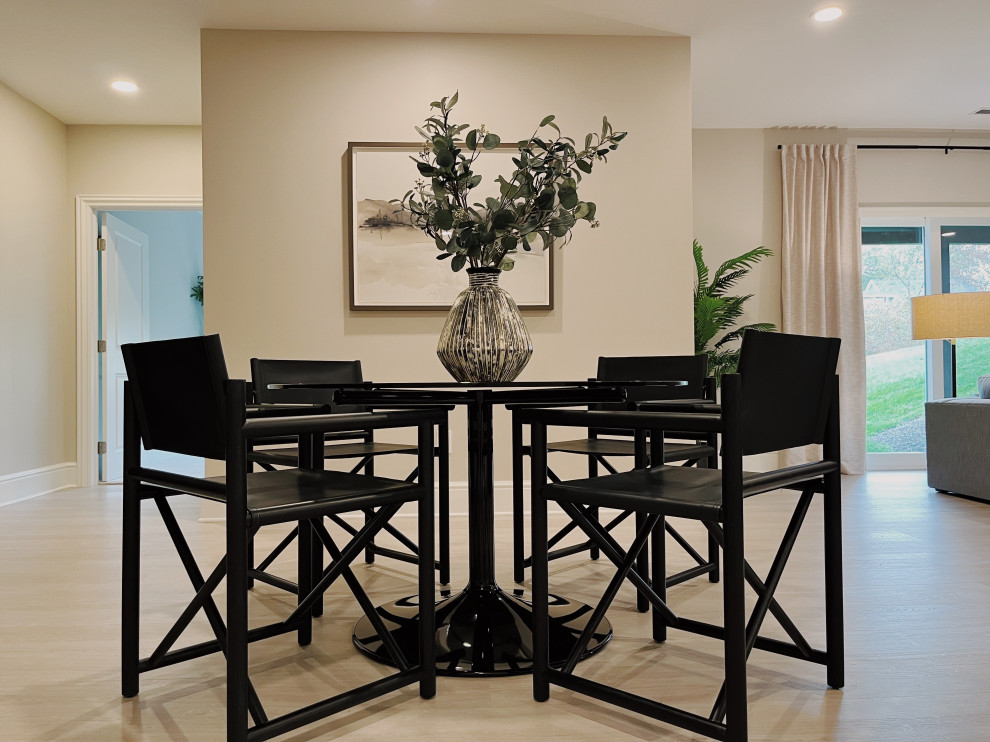 Inspiration for a large modern walk-out vinyl floor and beige floor basement remodel with a bar, beige walls, a corner fireplace and a tile fireplace