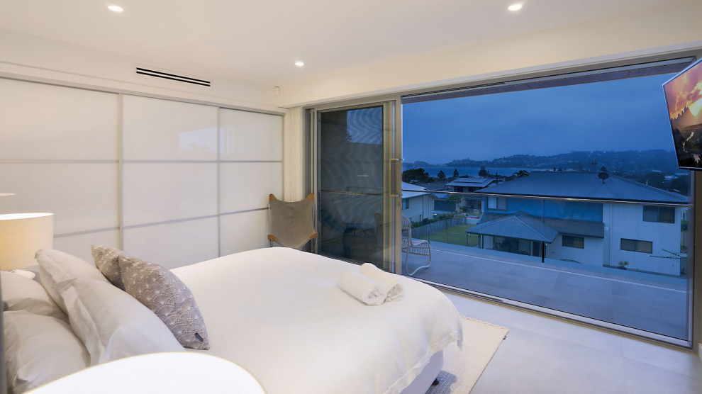 Photo of a modern bedroom in Newcastle - Maitland.